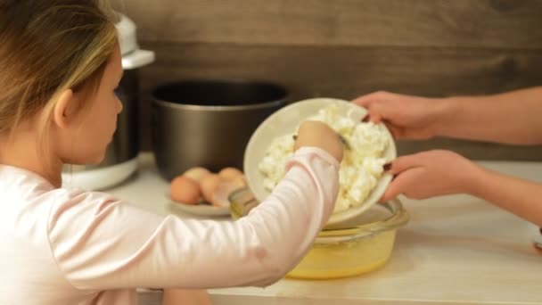 Little girl helping cooking dough — Stock Video