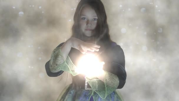 Girl with magician light — Stock Video