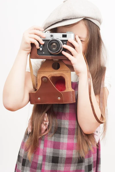 Fotografen flicka på en vit bakgrund — Stockfoto