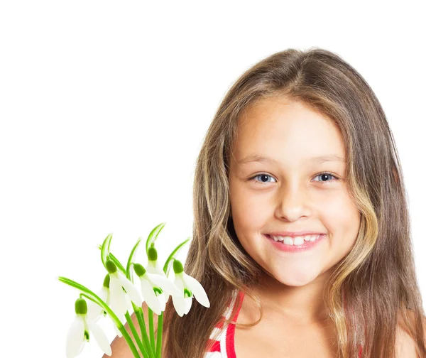 Portrait of cute little girl with a bouquet of snowdrops — Stock Photo, Image