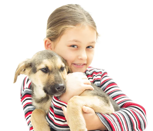 Fille et chiot sur un fond blanc — Photo