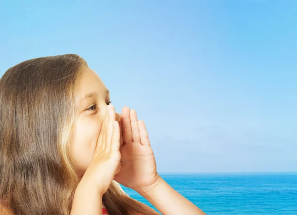 Little girl said putting his hand to his mouth — Stock Photo, Image