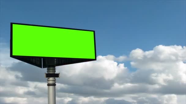 Green billboard on sky background — Stock Video
