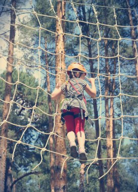 tourist jumps an obstacle