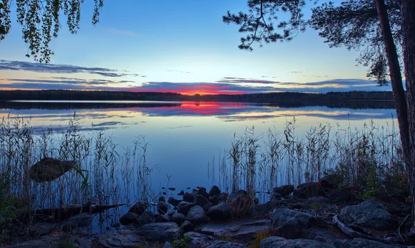 Dramatic clouds over rural lake — Stock Photo, Image