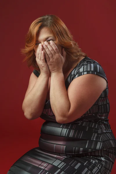 Laughing hard in cocktail dress — Stock Photo, Image