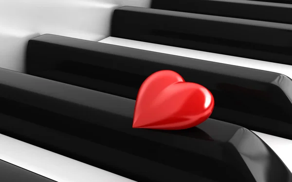 Corazón rojo sobre teclas de piano —  Fotos de Stock