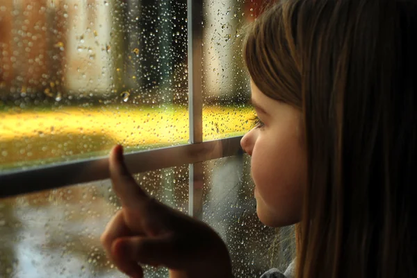 Meisje en regen Stockafbeelding