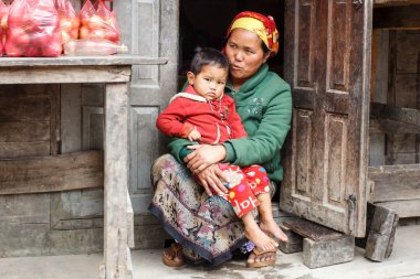 Local Woman holding Child in Myanmar