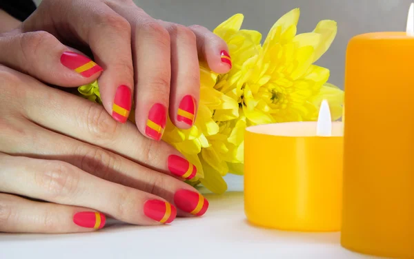 Pink and yellow striped nail art manicure — Stock Photo, Image