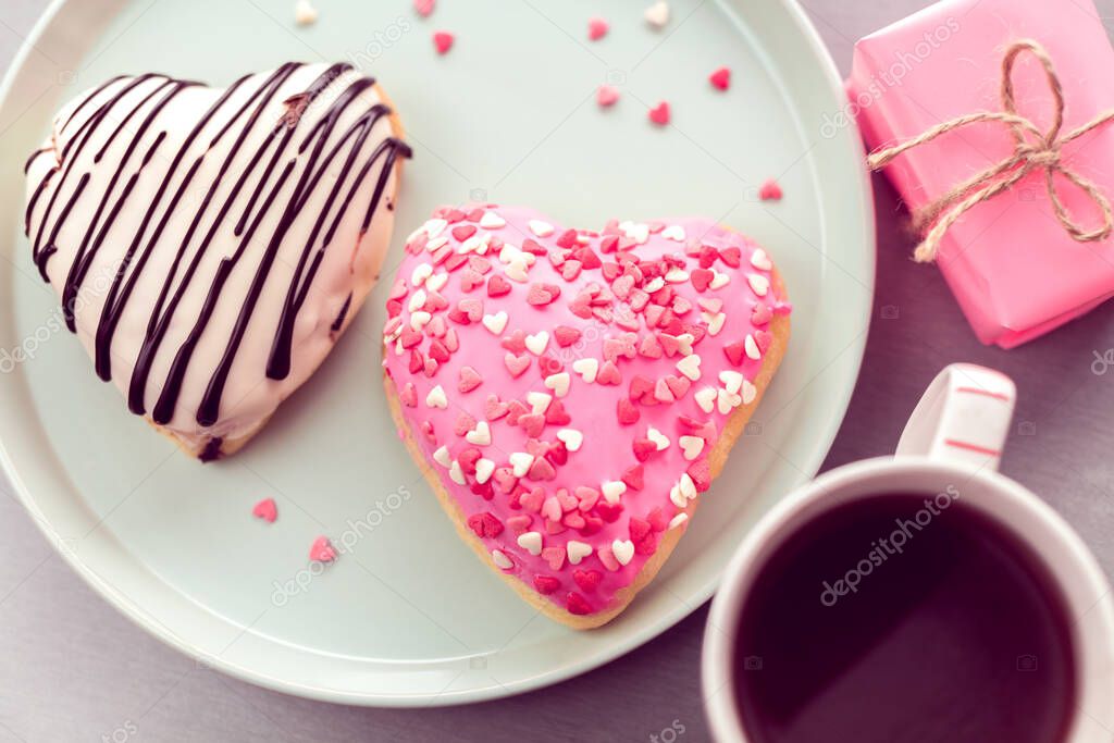 sweet heart shaped donuts with coffee