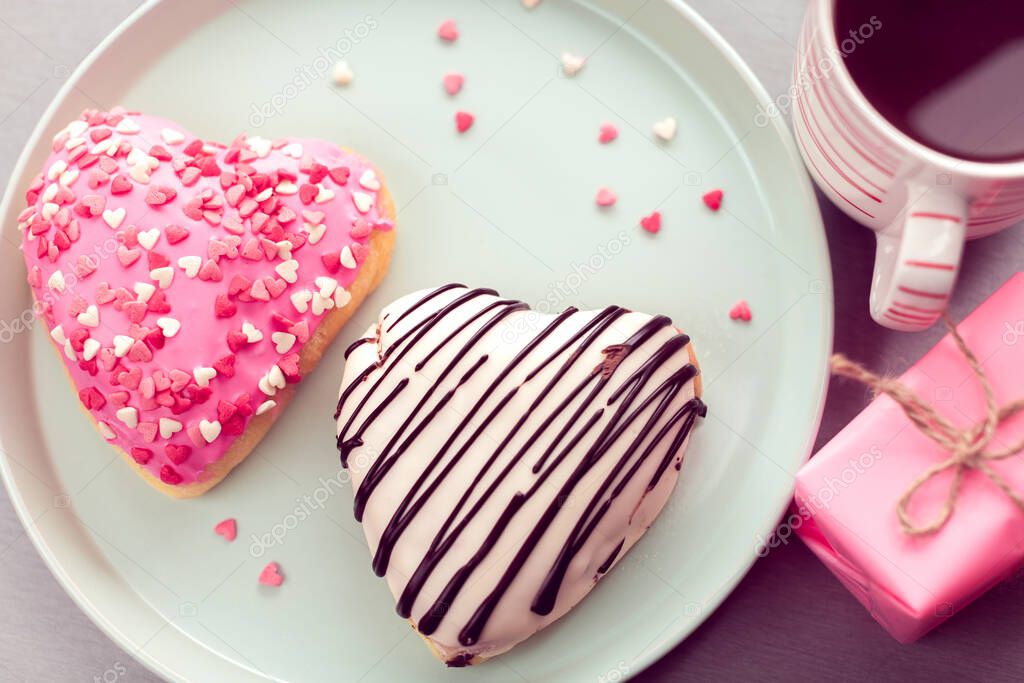 sweet heart shaped donuts with coffee
