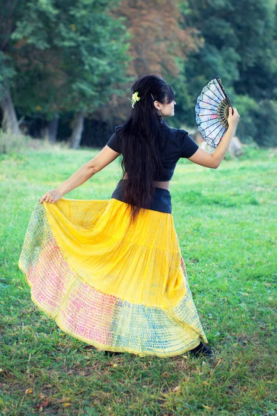 Woman dancing with traditional fan — Stock Photo, Image