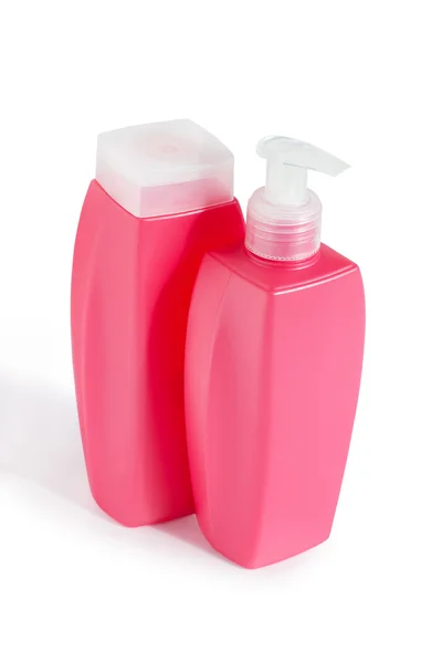 Две розовые пластиковые бутылки — стоковое фото
