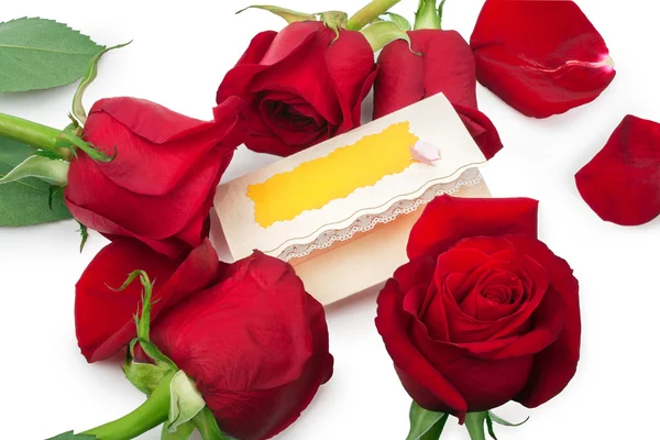 Rose rosse intorno carta regalo vuota — Foto Stock