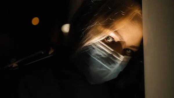 Close view: Scary tired female doctor at night Stock Picture