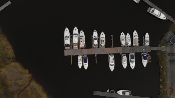 Luxury yachts in small harbor, aerial view of sail boat parking spot — Stock Video