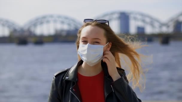 Stylish blonde woman takes off surgical mask and makes deep breath close view — Stockvideo