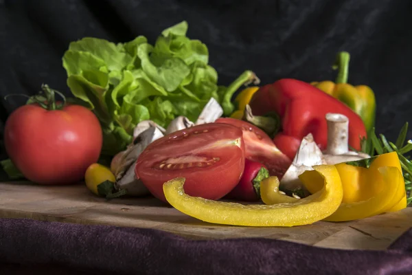 Colorful mix of fruits and vegetables, black background — Stock Photo, Image