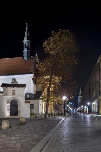 Arrendamentos antigos e igreja em Cracóvia, Polônia — Fotografia de Stock