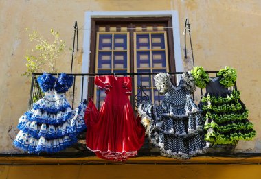 Traditional flamenco dresses at a house in Malaga, Andalusia, Sp clipart