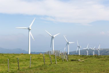 Wind turbines on a wind farm in Galicia, Spain clipart