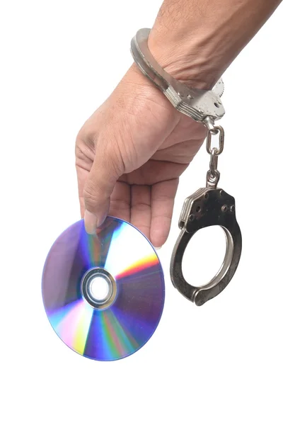 DVD in hand met handboeien — Stockfoto