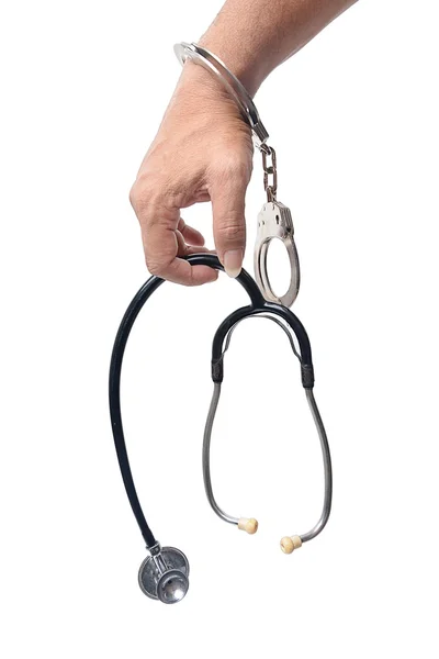 Lekarz z stetoskop w kajdankach — Zdjęcie stockowe