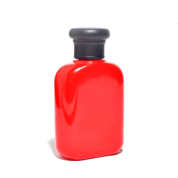 La bouteille emballage de couleur rouge isolé sur fond blanc — Photo