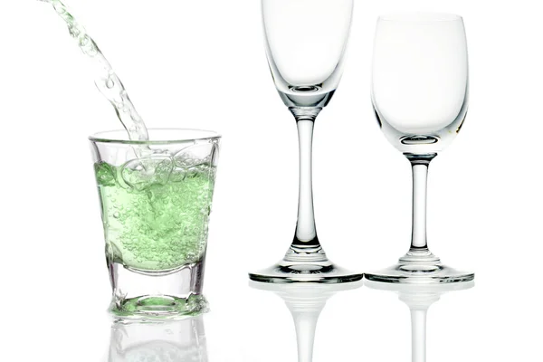 Green cocktail with splashes on white — Stock Photo, Image