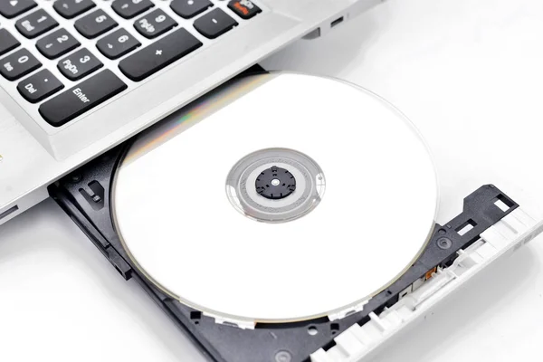 Laptop with the blank disk — Stock Photo, Image