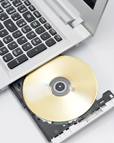 Laptop with the blank disk — Stock Photo, Image