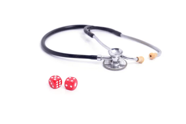 Red dice and Stethoscope on white background. — Stock Photo, Image