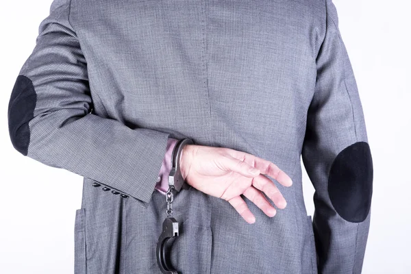 Elegant businessman in handcuffs — Stock Photo, Image