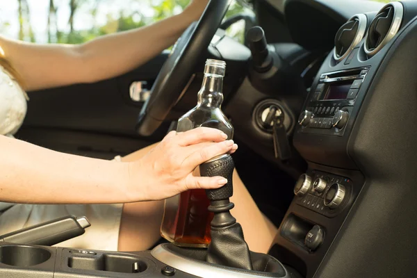 Woman drinking alcohol in the car. — Stock Photo, Image