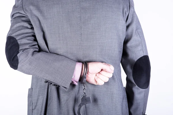 Elegant businessman in handcuffs — Stock Photo, Image