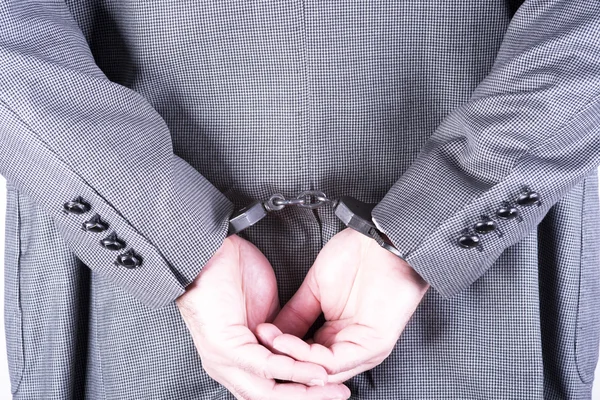 Elegant businessman in handcuffs — Stock Photo, Image