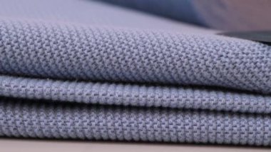 Modern Mavi yünlü kumaş. Jersey 'e yakın çekim. Örgü kumaşın dokusu. Yüksek kalite modern kadın süveter örgü dokusu. .