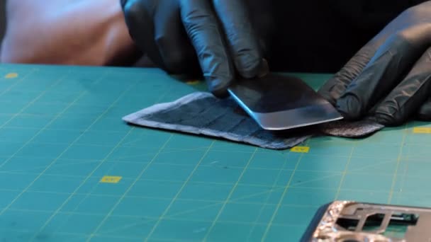 Leather worker. Craftsman working with leather. piece of leather on table at workshop. Leather craft. — Stock videók