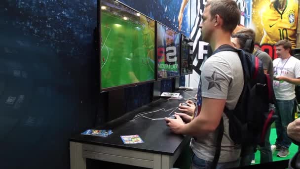 Teenagers playing video games in computer club, soccer tournament — Stock Video