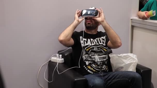 Virtual reality game. Man using with virtual reality glasses. Virtual reality game — Stock Video