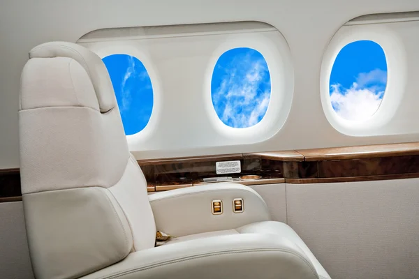 Aircraft porthole with clouds view — Stock Photo, Image