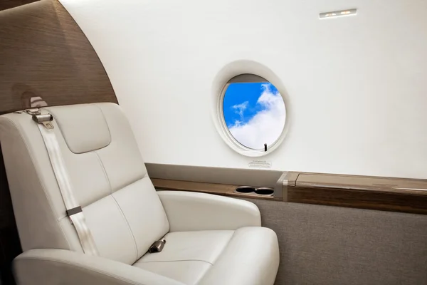 Aircraft porthole with clouds view — Stock Photo, Image