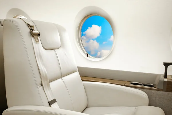 Business jet flight, aiircraft porthole view — Stock Photo, Image