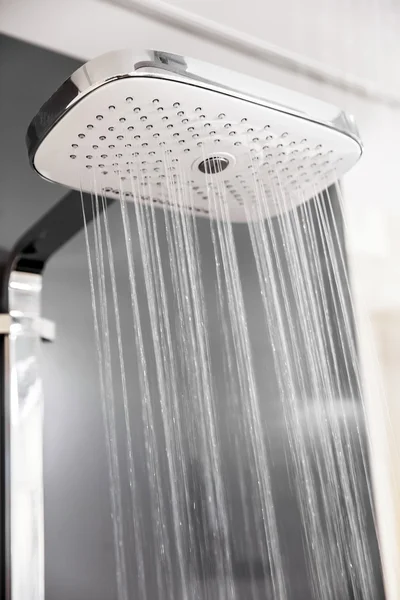 Shower head with sprinkling water — Stock Photo, Image