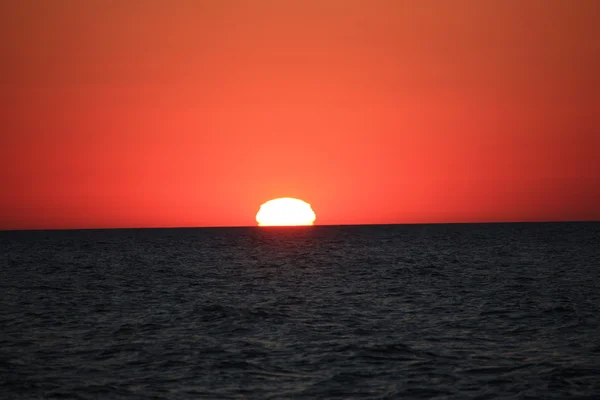 Beach Sun water weather sea sand waves people sky holiday sunbather sunset