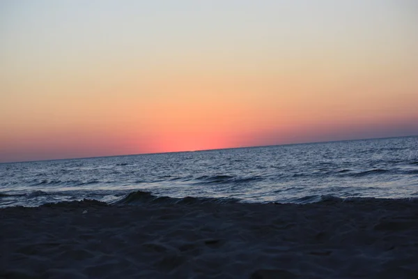 Beach Sun water weather sea sand waves people sky holiday sunbather sunset — Stock Photo, Image