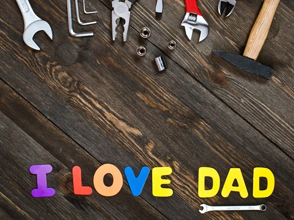 Letters and tools wooden background fathers day — Stock Photo, Image