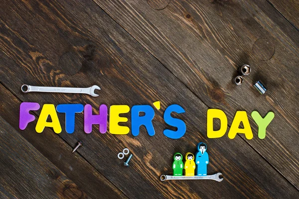 Letters and tools wooden background fathers day — Stock Photo, Image