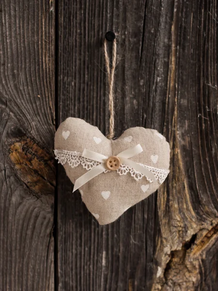 Wooden heart hanging on a branch — Stock Photo, Image